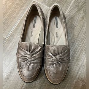 Metallic bronze Clarks loafers with soft cushion
